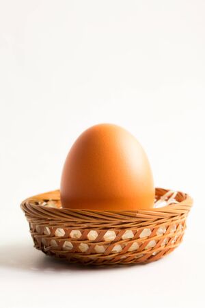 egg in basket wicker on white background,Duck eggs in baskets .の写真素材