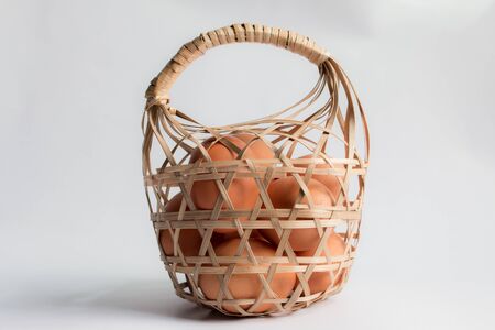egg in basket wicker on white background,Duck eggs in baskets .の写真素材