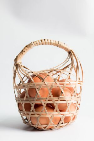 egg in basket wicker on white background,Duck eggs in baskets .の写真素材