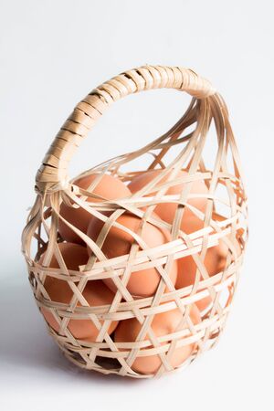 egg in basket wicker on white background,Duck eggs in baskets .の写真素材
