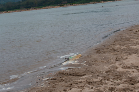 Waste on the sands causes environmental pollution. ocean beach. trash on beachの写真素材