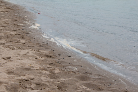 Waste on the sands causes environmental pollution. ocean beach. trash on beachの写真素材