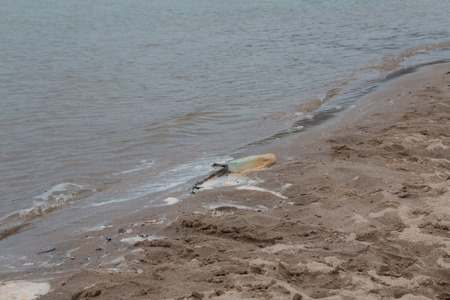 Waste on the sands causes environmental pollution. ocean beach. trash on beachの写真素材