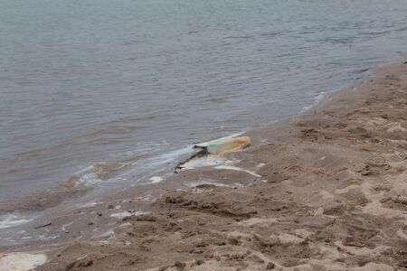Waste on the sands causes environmental pollution. ocean beach. trash on beachの写真素材