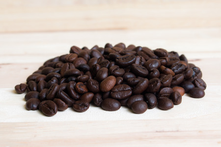 Coffee beans on Wood backgroundの写真素材