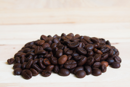 Coffee beans on Wood backgroundの写真素材