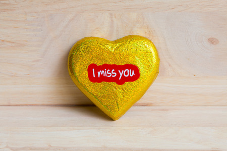 Chocolate wrapper  on Valentine's Day,Wood background