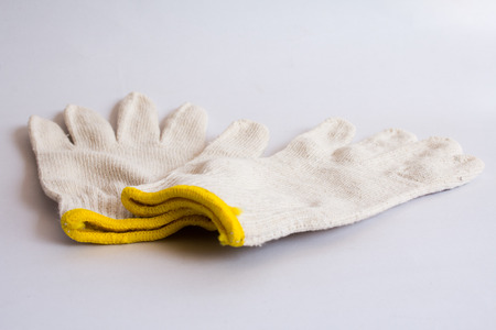 White cotton gloves isolated on white background.の写真素材