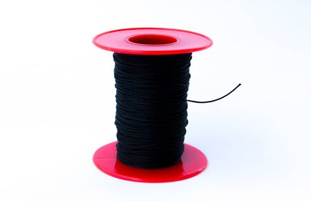 Black thread on a white background.の写真素材