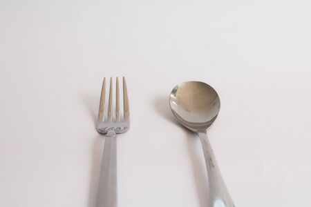 fork and spoon on white backgroundの写真素材