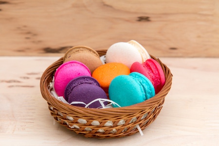 Colorful  macaroons in stack on light wooden backgroundの写真素材