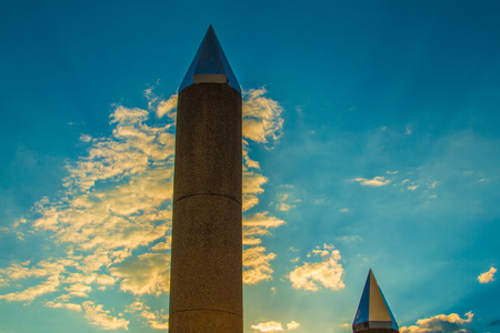 Cement poles tipped sky background.の写真素材