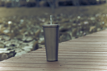 Stainless steel mug On the wood floorの写真素材