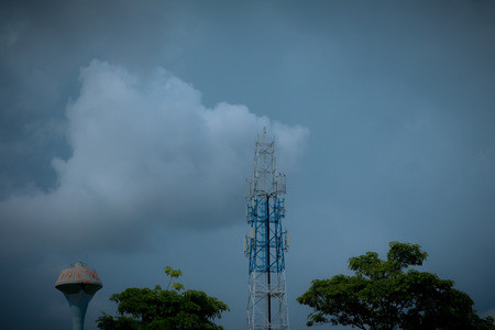 Signal towers and rain clouds are coming.の写真素材