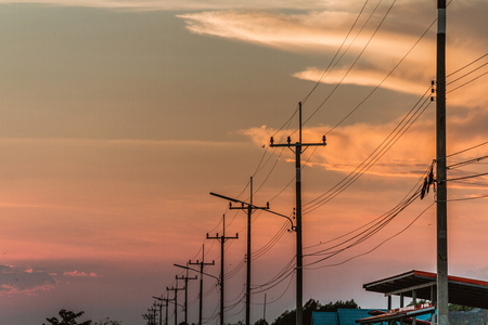 silhouette electric pole and sunset timeの写真素材