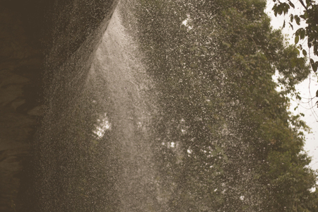Waterfall in tropical forest at So Da Cave Temple in Thailand.の写真素材