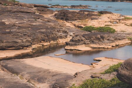 Beautiful amazing of rocks, Natural of rock canyon in mekhong river , Hat Chom Dao, Ubon Ratchathani province, North east Thailandの写真素材