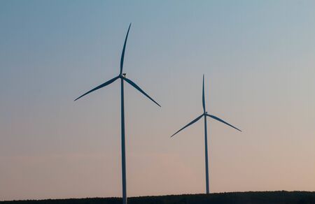 Wind turbines on land field with  sky backgroundの写真素材