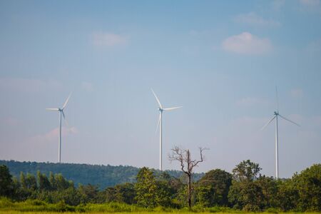 Wind turbines on land field with  sky backgroundの写真素材