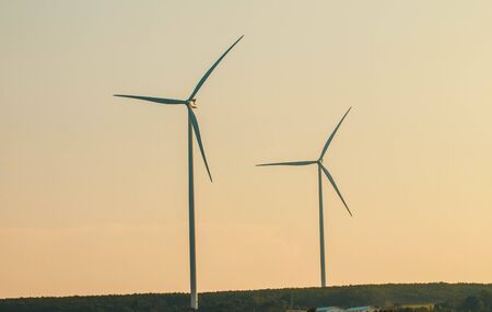 Wind turbines on land field with  sky backgroundの写真素材