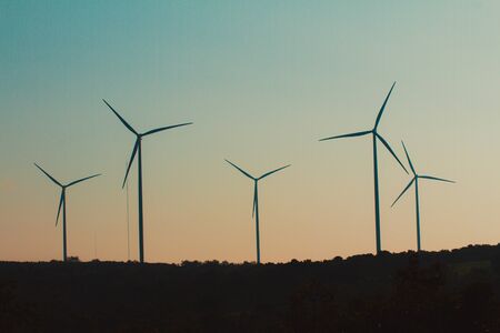 Wind turbines on land field with  sky backgroundの写真素材