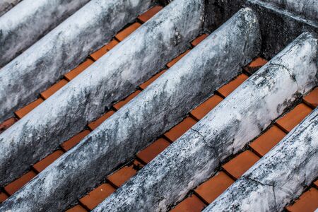 Ancient roof structure tile is an , traditional roof tile and is still in use in the Asian regionの写真素材