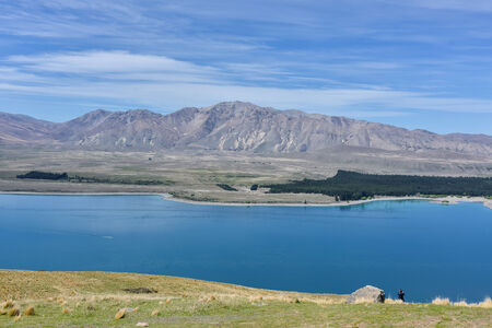 blue pool and brown hillの写真素材