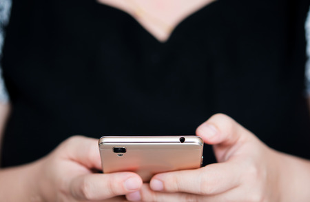 Girl transfer information on mobile deviceの写真素材