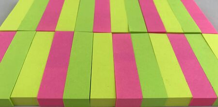 Rainbow multi colored paper background in light box.