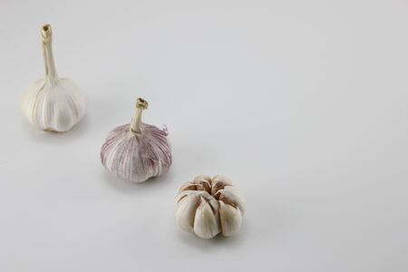 Garlic placed on a white background.の写真素材