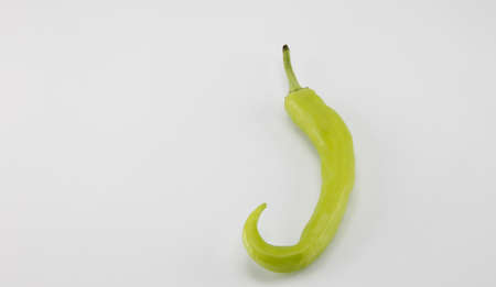 Green peppers placed on a white background.の写真素材