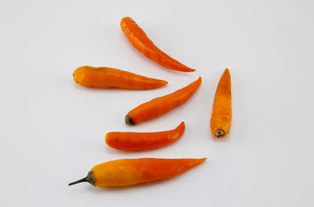 Yellow peppers placed on a white background