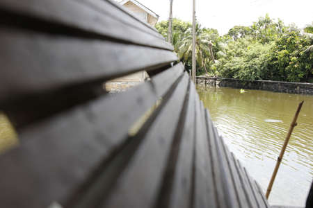 The battens are made of wood along the water's edge.の写真素材