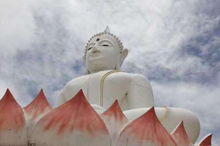 White Buddha statue located in the temple.の写真素材