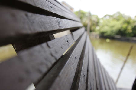 The battens are made of wood along the water's edge.の写真素材