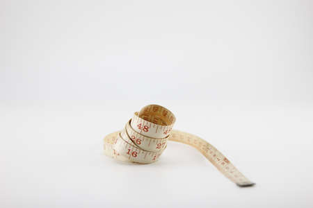 Tape measure for garment Put on a white background.の写真素材