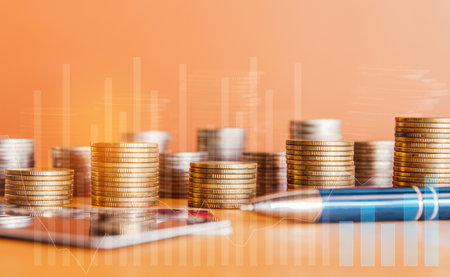 Stack of coins and graph, business planning and financial growth concept.の写真素材