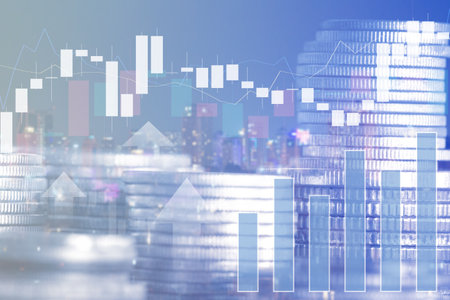Double exposure of coin stack with cityscape and financial graph, business and investment conceptの写真素材