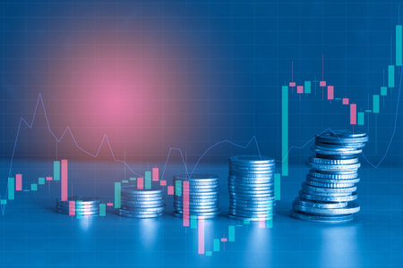 Stacks of coins with stock market graph background, business and finance concept idea.の写真素材