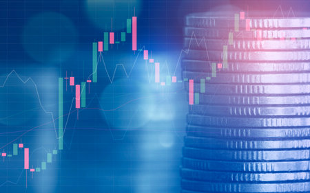 Investment concept,Stack of coins with stock market graph background.の写真素材