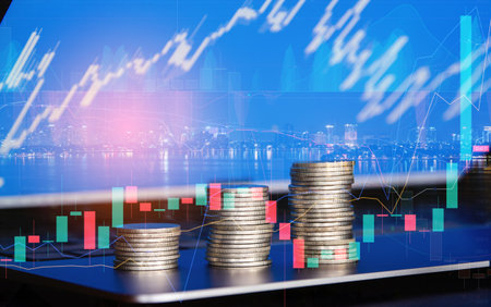 Double exposure of coin stack with stock market graph, business and finance concept idea.の写真素材