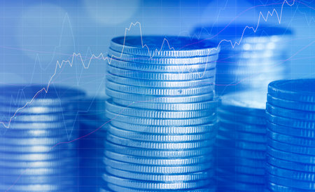Stacks of coins with forex chart background. Financial concept.の写真素材