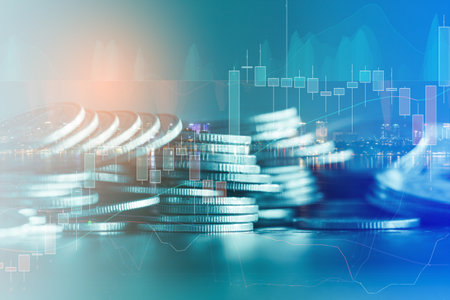 Double exposure of coin stack with financial graph and stock market or forex trading graph and candlestick chart suitable for financial investment concept.の写真素材