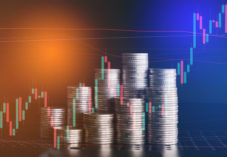 Double exposure of coin stack with stock market graph and candle stick for financial and investment concept.の写真素材