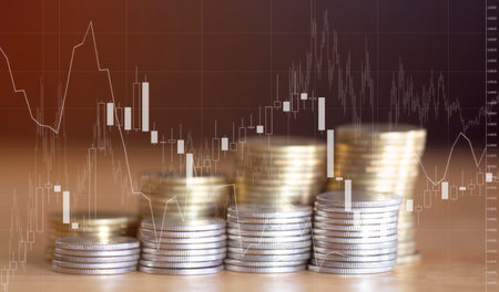 Investment concept, Coins graph stock market financial on wooden background.の写真素材