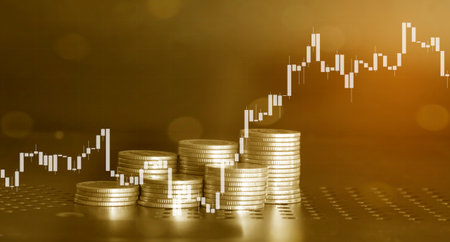 Double exposure of coin stack with stock market or forex trading graph and candlestick chart suitable for financial investment concept.の写真素材