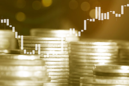 Double exposure of coin stack with financial graph and stock market or forex trading graph and candlestick chart suitable for financial investment concept.の写真素材