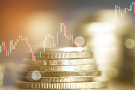 Double exposure of coin stack with stock market or forex trading graph and candlestick chart suitable for financial investment concept.の写真素材