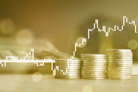 Double exposure of coin stack with stock market graph and candle stick graph, business and financial concept idea.の写真素材
