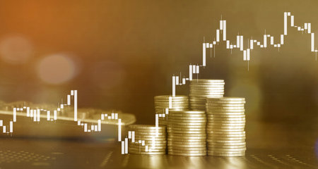 Investment concept, Coins graph stock market with bokeh background.の写真素材